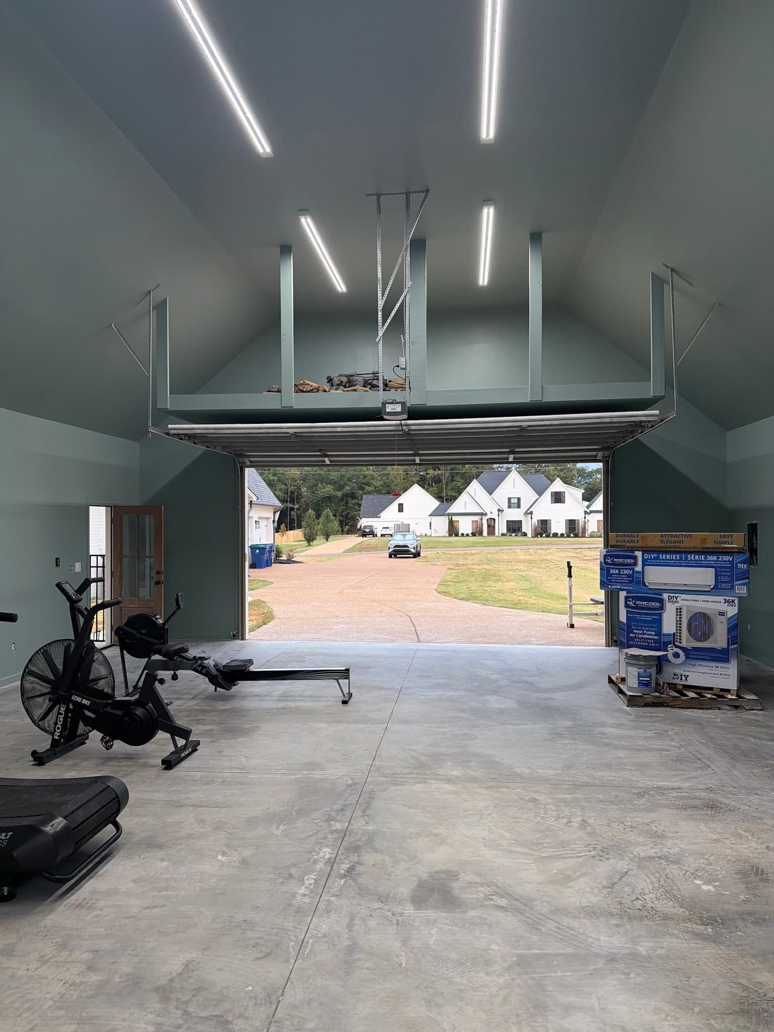 Converted garage interior with finished, painted walls and a vaulted ceiling, completed by Drywall & Remodeling ETC. in Memphis, TN